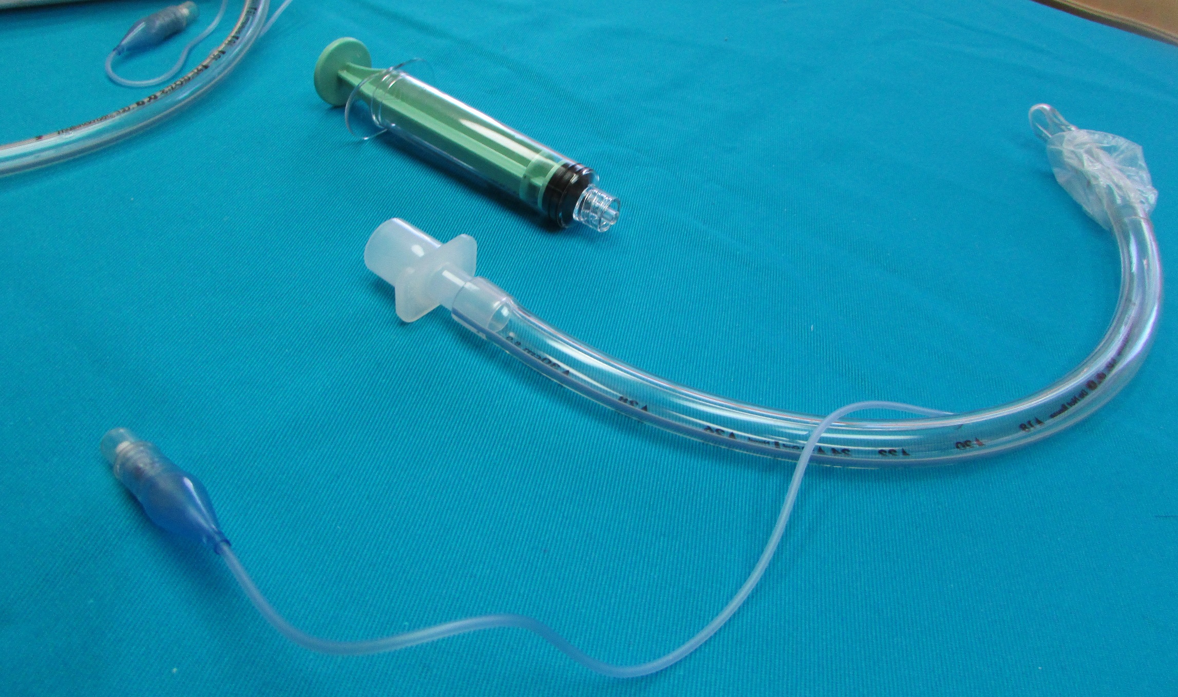An endotracheal tube with syring for inflation on bedding